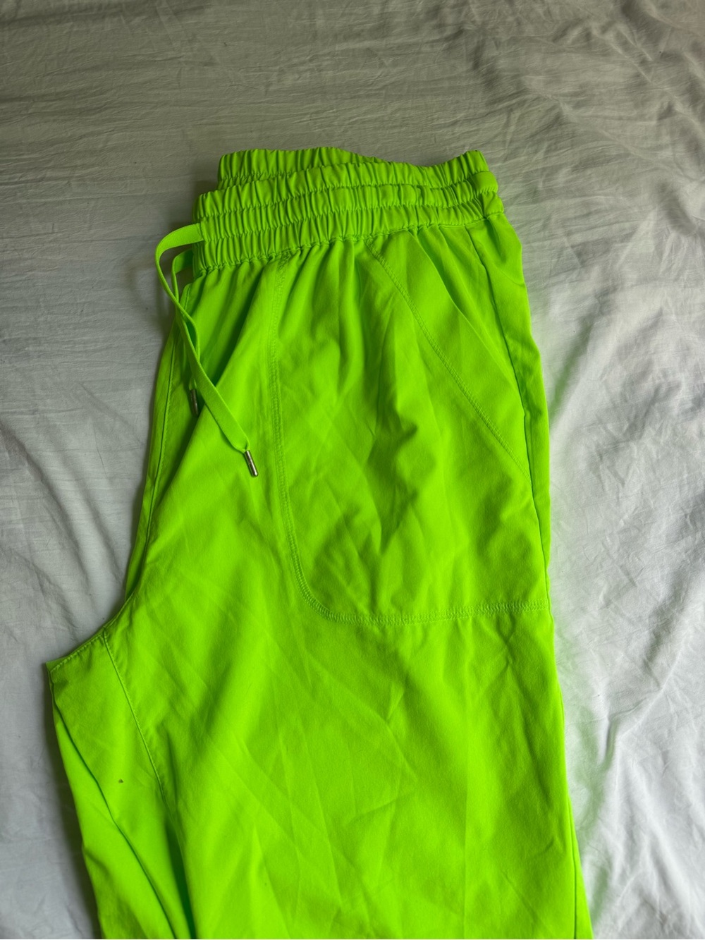 TNA neon track pants